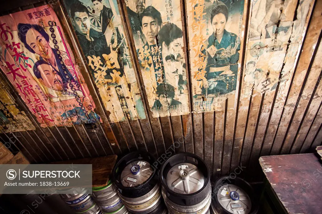 Old Posters and Advertisements With Kegs of Beer in Bar, Tokyo, Japan