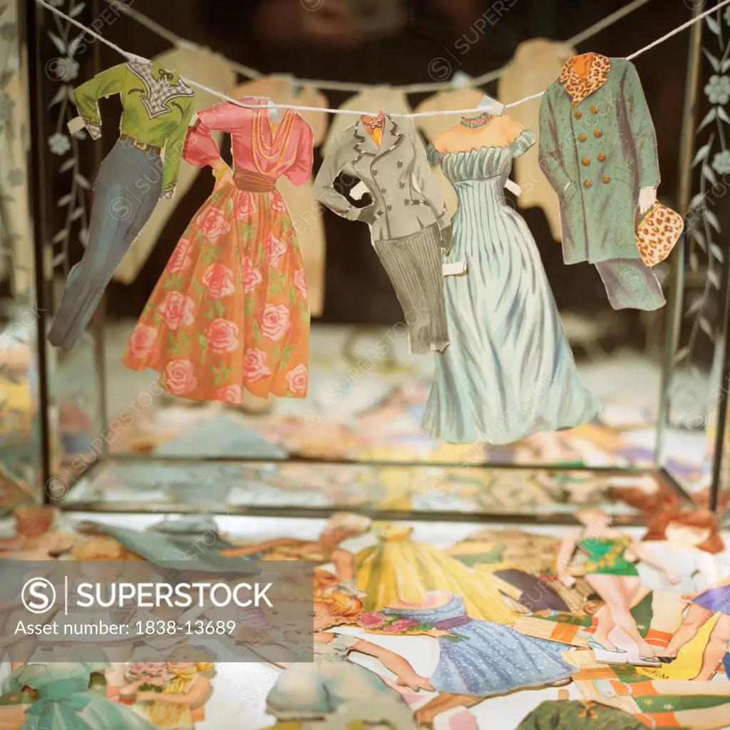 Paper Doll Clothes on Line in Front of Mirror