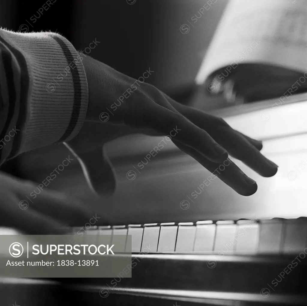 Hand Playing Piano, Close-Up