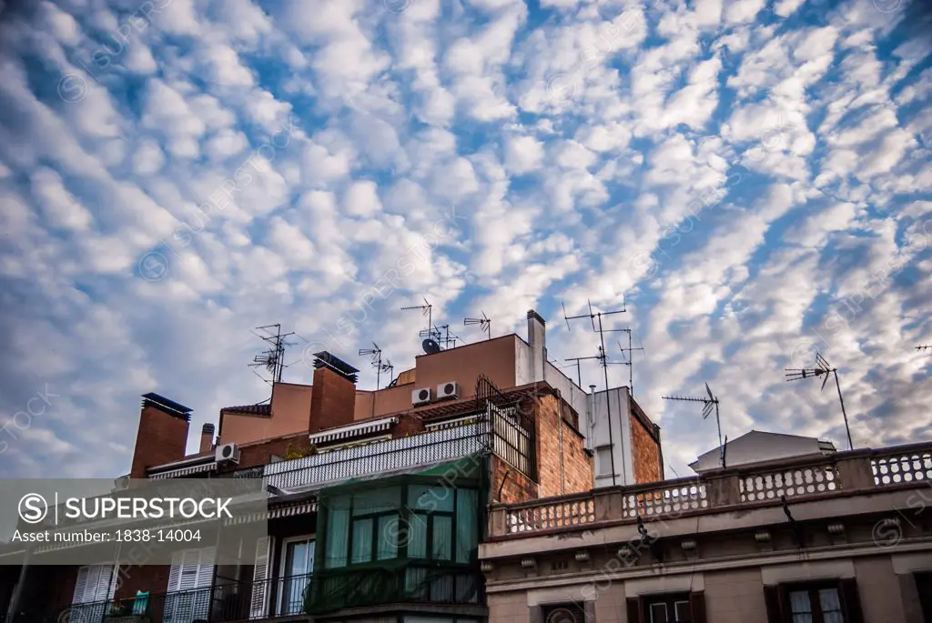 Building Rooftop Under Altocumulus Clouds in Sky, Barcelona, Spain