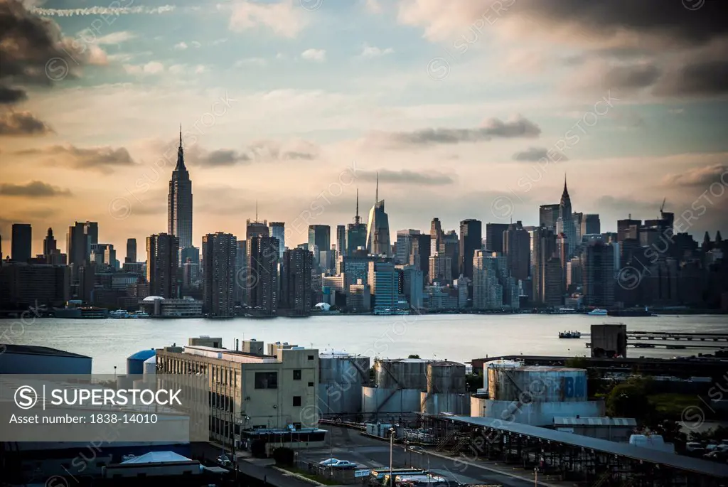 Midtown Manhattan Skyline and East River Under Dramatic Sky