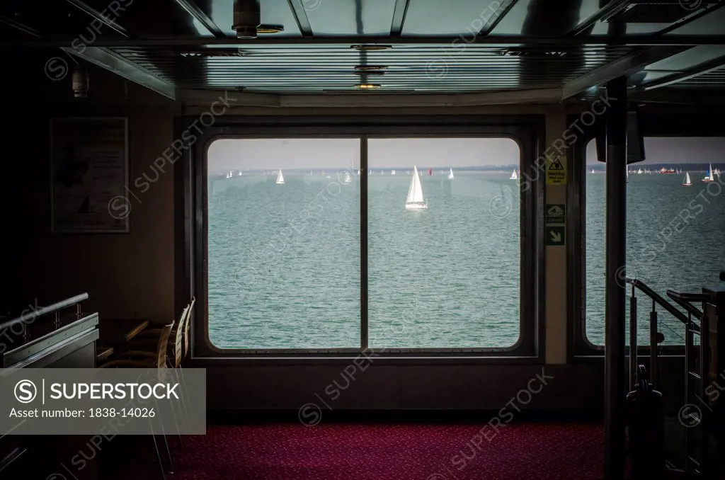 View of Sailboats in Bay from Ferry Interior