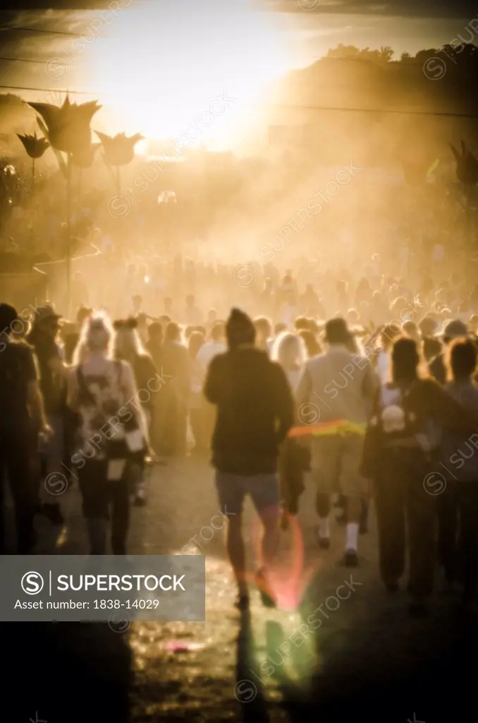 Crowd of Young People Moving Through Summer Music Festival in Warm Light, Isle of Wight, UK