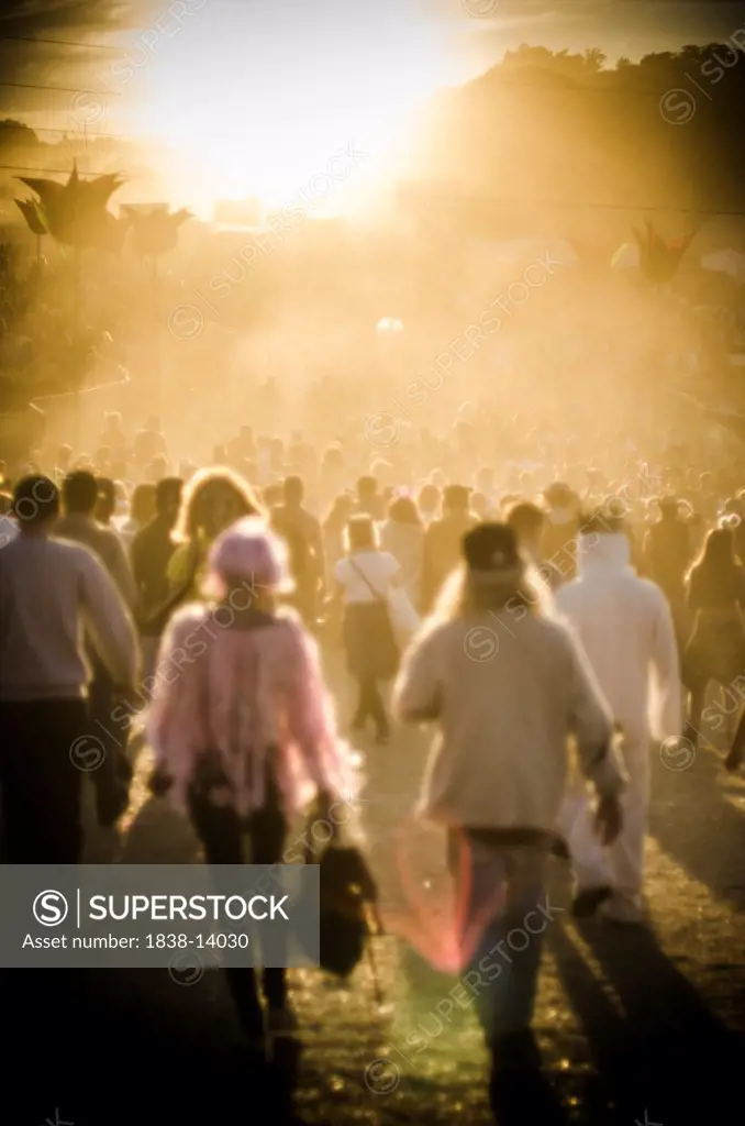Crowd of Young People Moving Through Summer Music Festival in Warm Light, Isle of Wight, UK