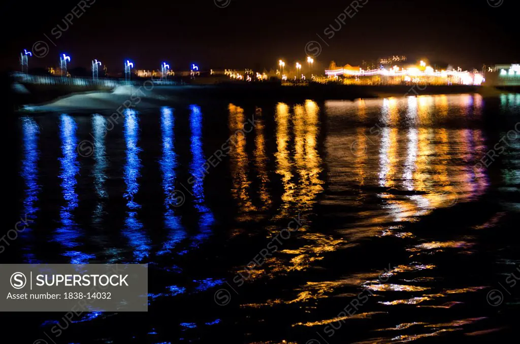 Rainbow of Light Reflections in Water at Night