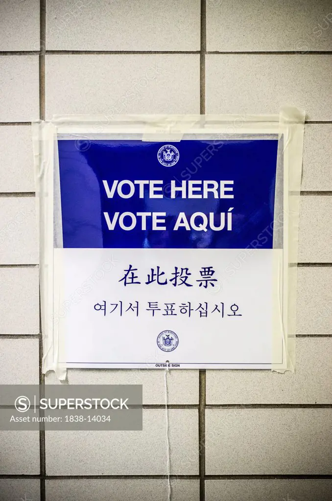 Vote Here Sign Taped to Tiled Wall