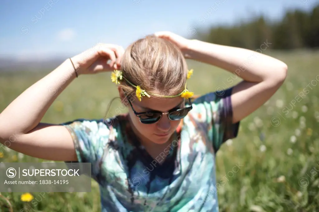 Young Woman Wearing Dandelion Headband