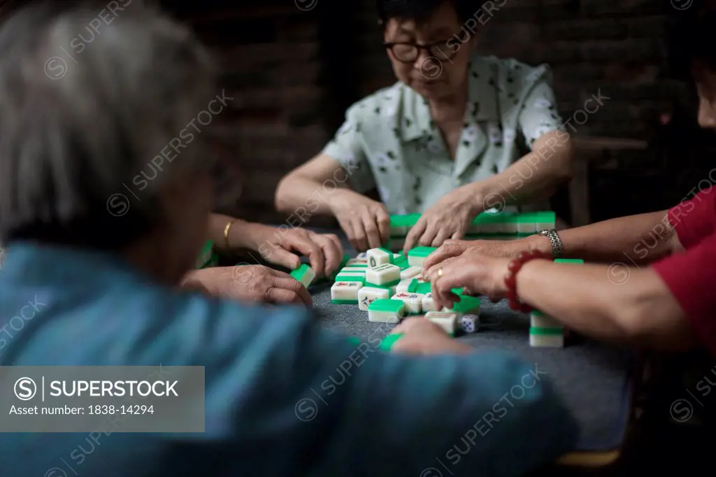Small Group of Women Playing Mah Jong