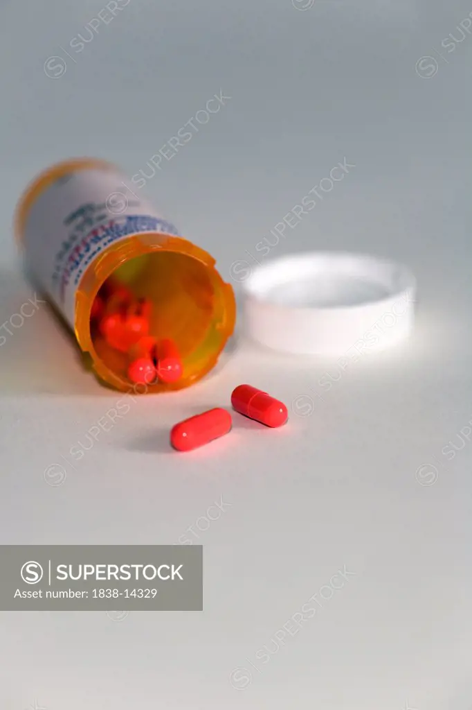 Capsules Spilling from Pill Bottle