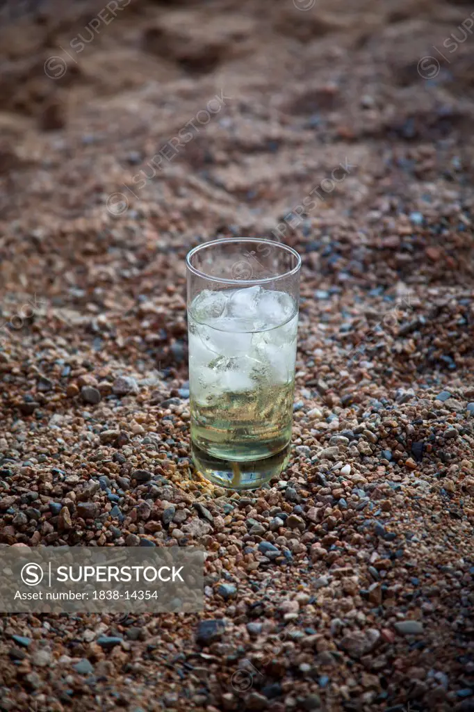 Cocktail in Glass With Ice on Beach