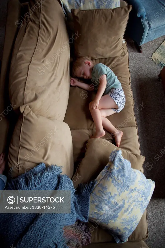 Young Boy Sleeping on Couch, High Angle View