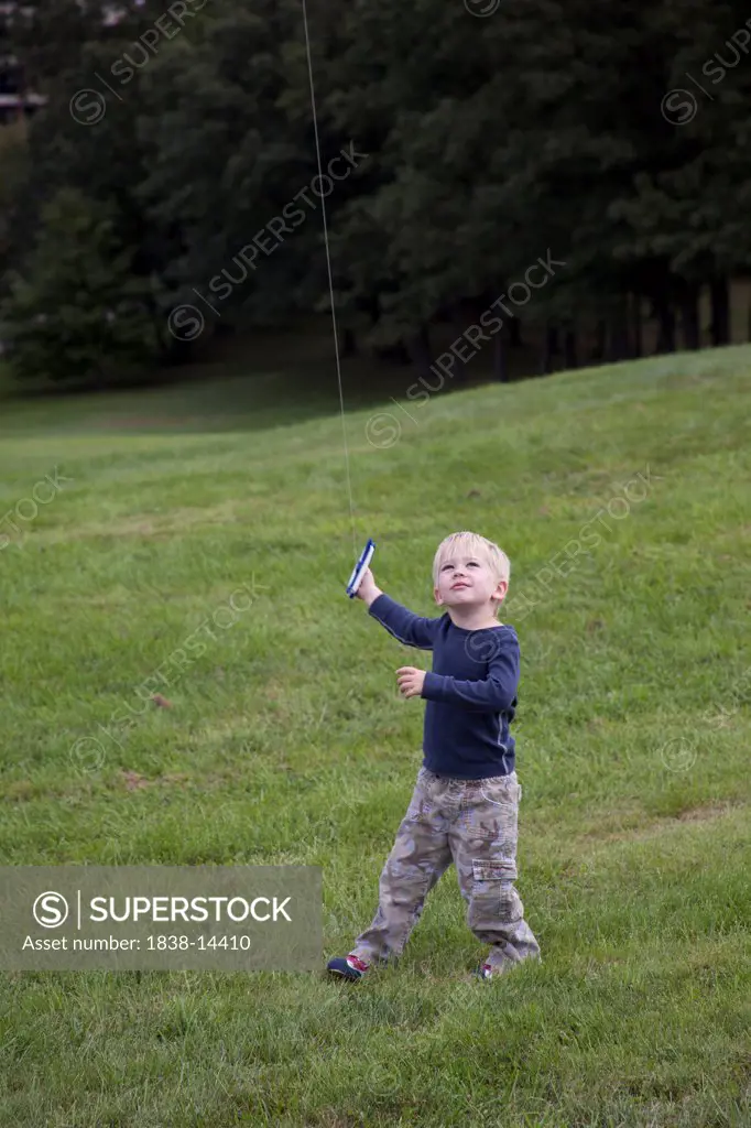 Young Boy Flying Kite