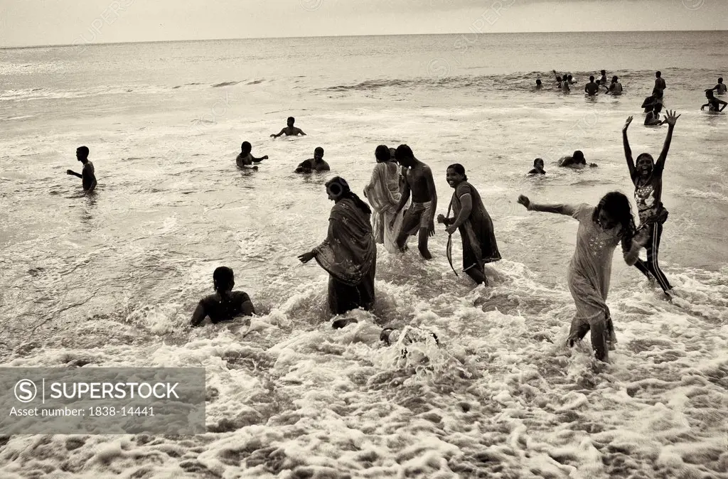 Group of People Playing in Ocean, India