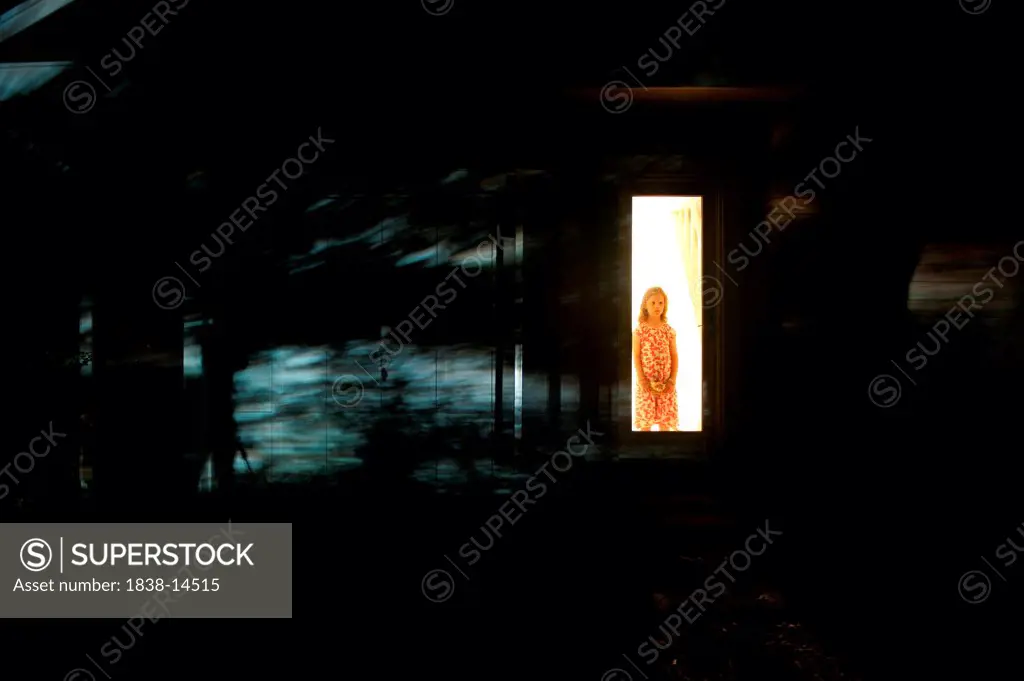 Girl Waiting Behind Screen Door With Shadows at Night