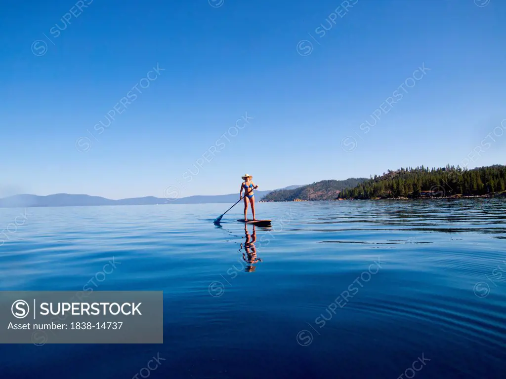 Woman Paddling on Lake