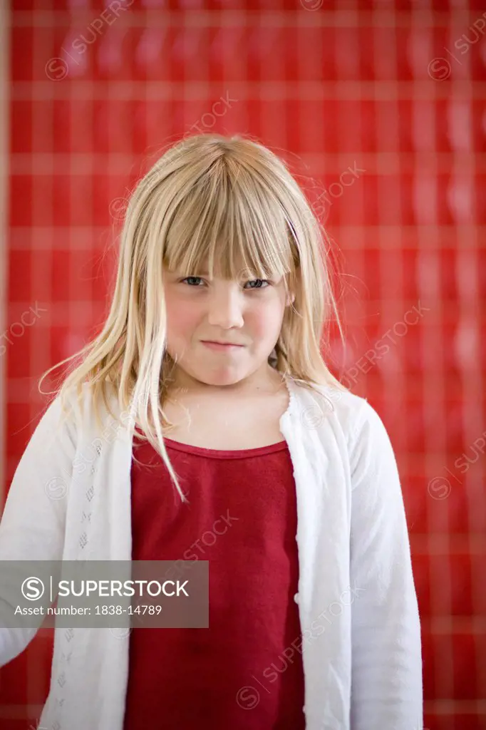 Annoyed Young Girl Standing Against, Red Tiled Wall