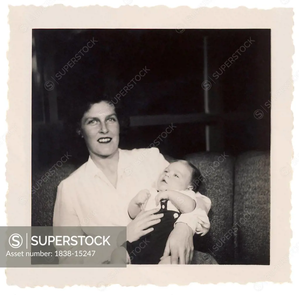Smiling Mother Holding Infant Son, Circa 1950's