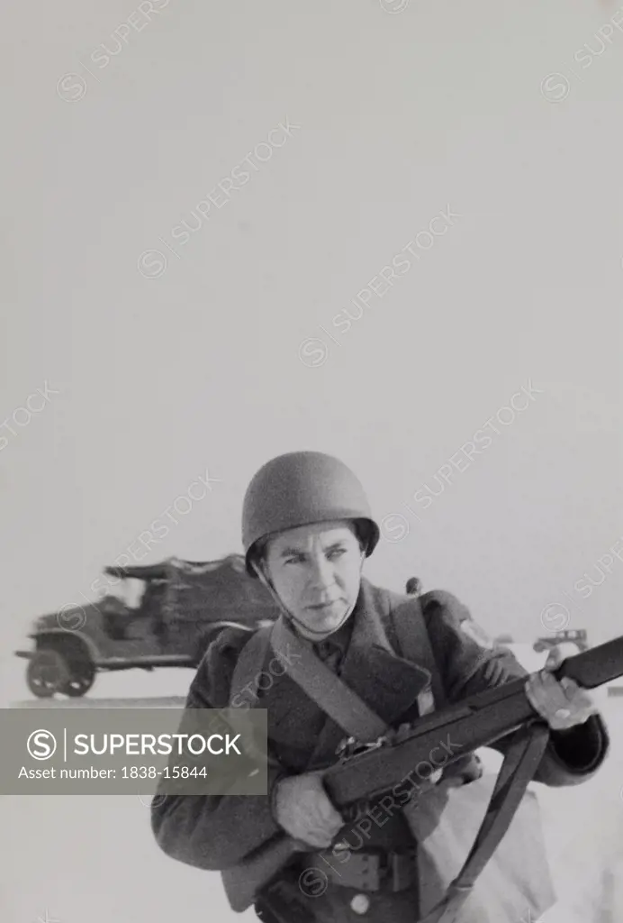 Military Soldier in Uniform Pointing  Rifle Portrait, WWII, HQ 2nd Battalion, 389th Infantry, US Army Military Base, Indiana, USA,  1942