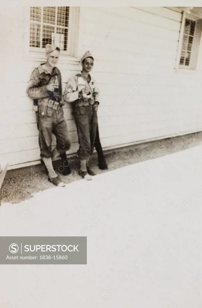 Portrait of Military Soldiers Leaning Against Military Building, WWII, 2nd Battalion, 389th Infantry, US Army Military Base, Indiana, USA, 1942