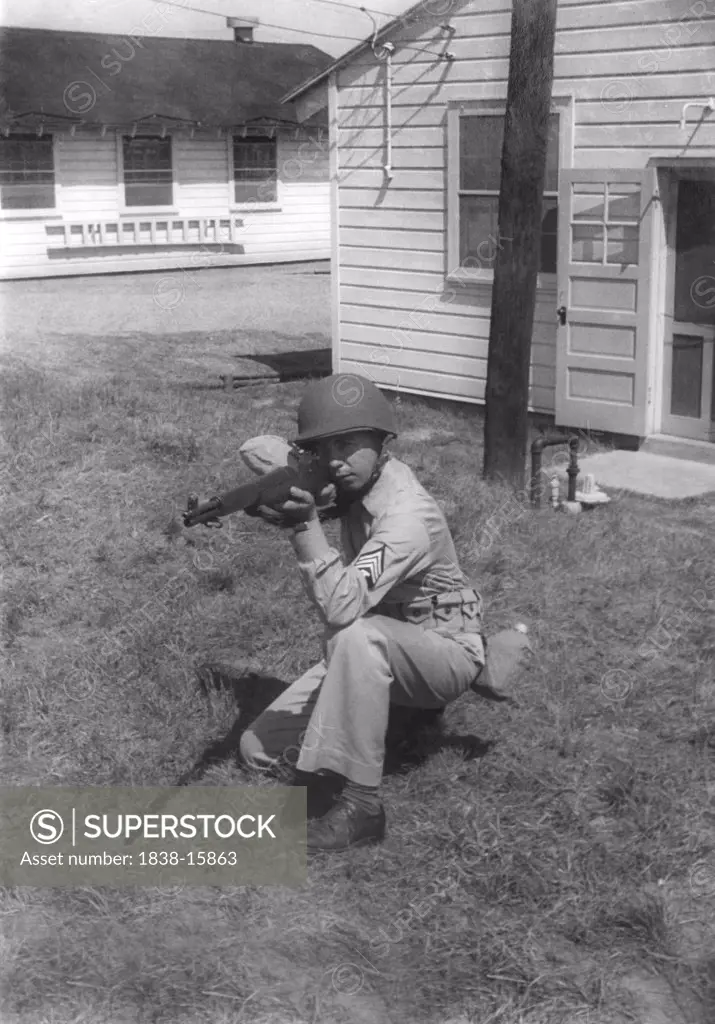 Soldier Displaying Proper Shooting Position During Training Session, WWII, 2nd Battalion, 389th Infantry, US Army Military Base Indiana, USA, 1942