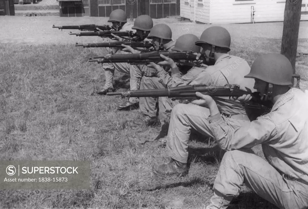 Group of Soldiers in Kneeling Position Displaying Proper Shooting Position During Training Session, WWII, 2nd Battalion, 389th Infantry, US Army Military Base Indiana, USA, 1942