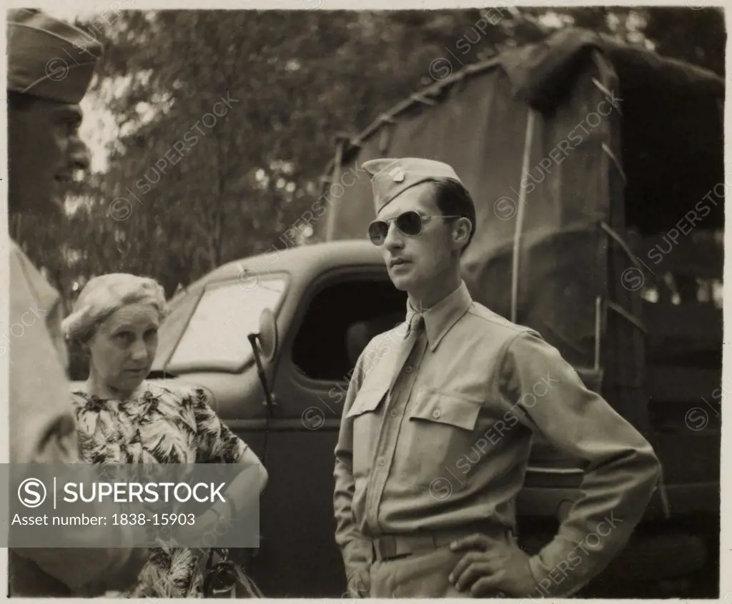 Soldier in Uniform and Aviator Sunglasses with Another Soldier and Civilian Woman, Portrait,  WWII, HQ 2nd Battalion, 389th Infantry, US Army Military Base, Indiana, USA, 1942