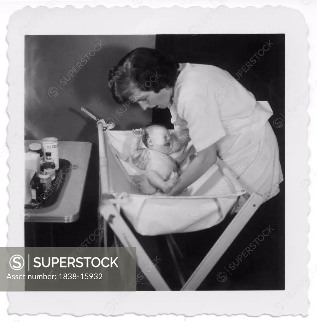 Mother Bathing Newborn Baby, 1952