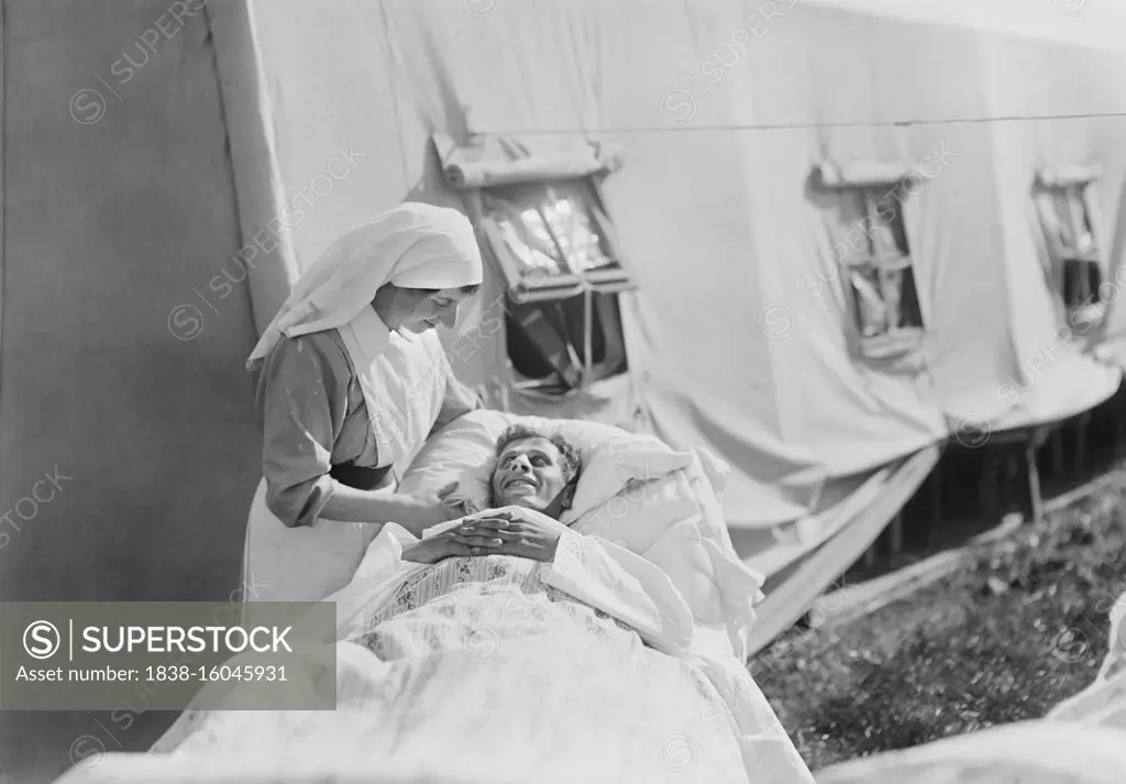 Nurse cheering up Injured American Soldier, American Military Hospital No. 5, supported by American Red Cross, Auteuil, France, Lewis Wickes Hine, American National Red Cross Photograph Collection, September 1918
