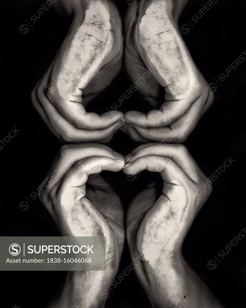 Two sets of Heart Hands against Black Background