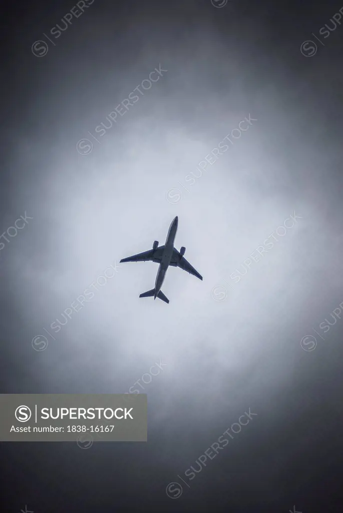 Airplane Surrounded by Cloudy Sky