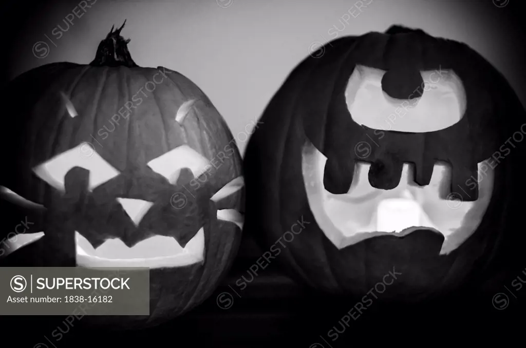 Two Carved Pumpkin Halloween Jack-O-Lanterns