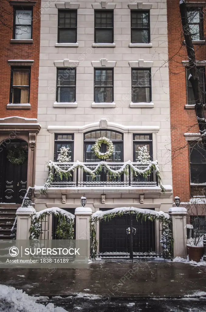 Snowy Winter Upscale Townhouse with Christmas Decorations, New York City, USA