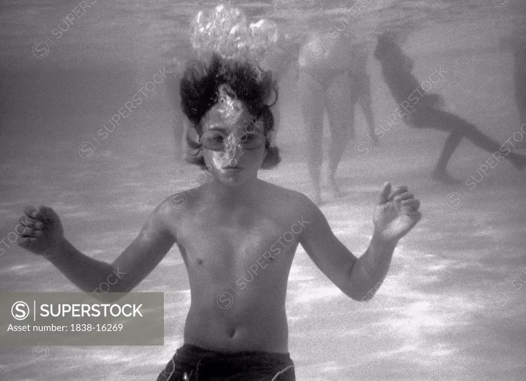 Teen Boy Breathing Bubbles Underwater