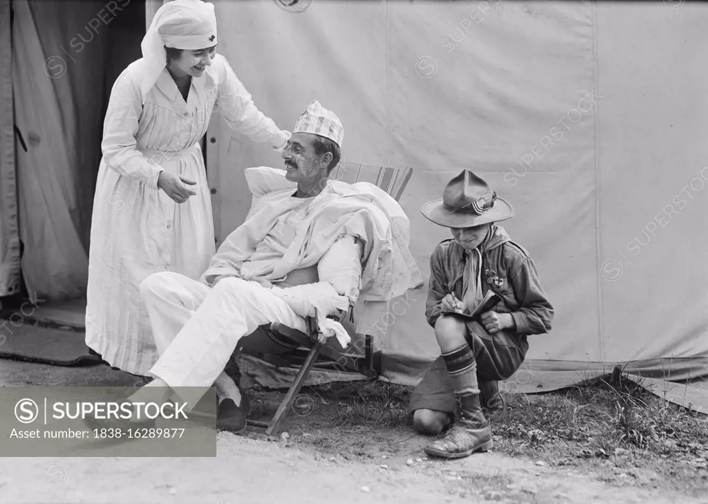 American Red Cross Nurse's Aide with injured American Soldier and Boy Scout, American Military Hospital No. 5, Auteuil, France, Lewis Wickes Hine, American National Red Cross Photograph Collection, August 1918