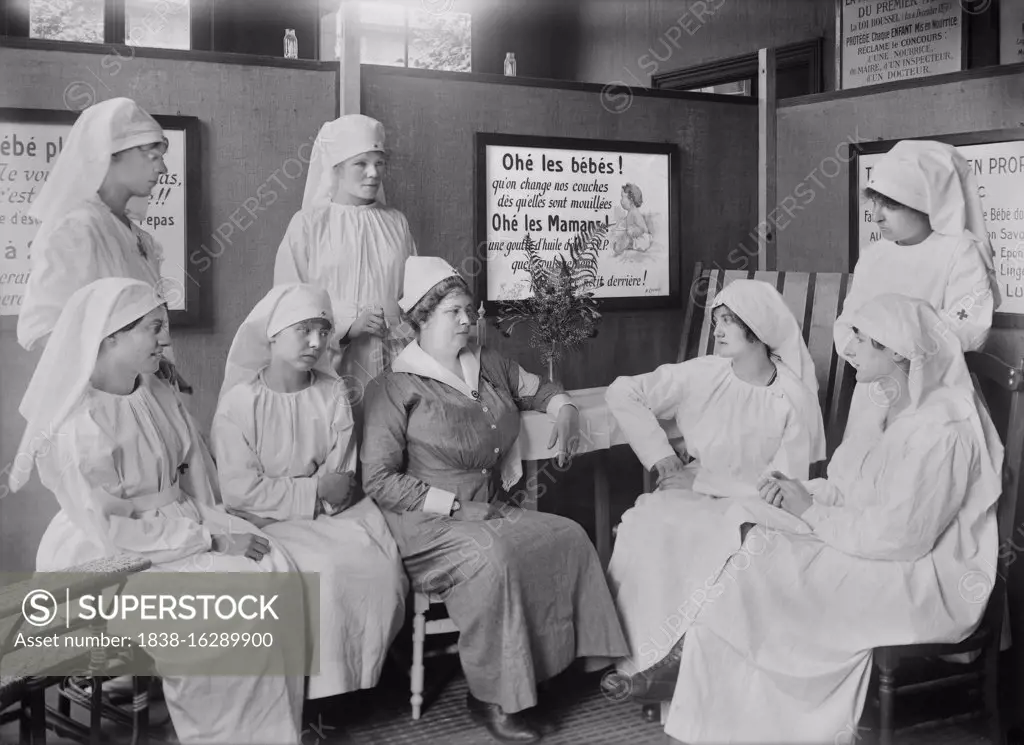 Miss Smythe, Head Nurse, American Red Cross, and staff of Volunteer Workers, attending Child Welfare Exhibit, St. Etienne, France, Lewis Wickes Hine, American National Red Cross Photograph Collection, July 1918