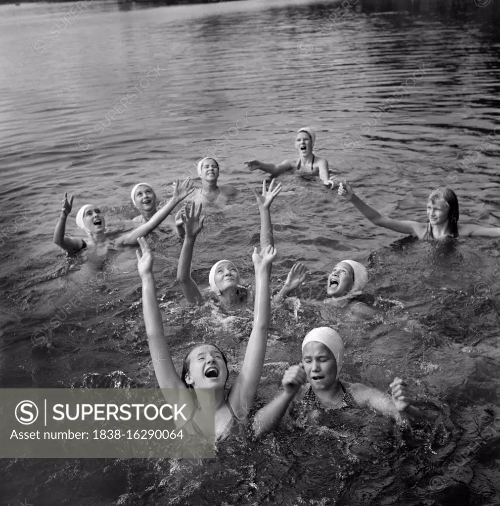 Group of Girls waiting to Catch Large Rubber Ball in Lake, National Music Camp, Interlochen, Michigan, USA, Arthur S. Siegel, U.S. Farm Security Administration, August 1942
