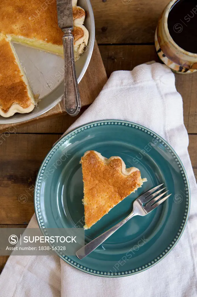 Slice of Buttermilk Pie on Blue Plate, High Angle View