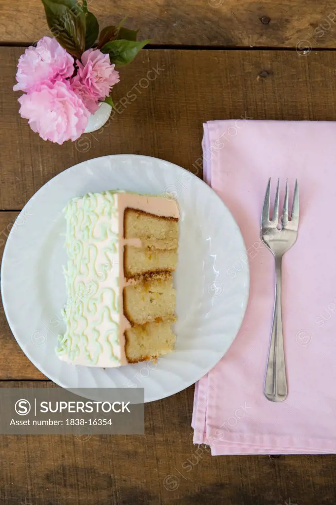 Slice of Frosted Sweet Tea Cake on Small Plate with Fork