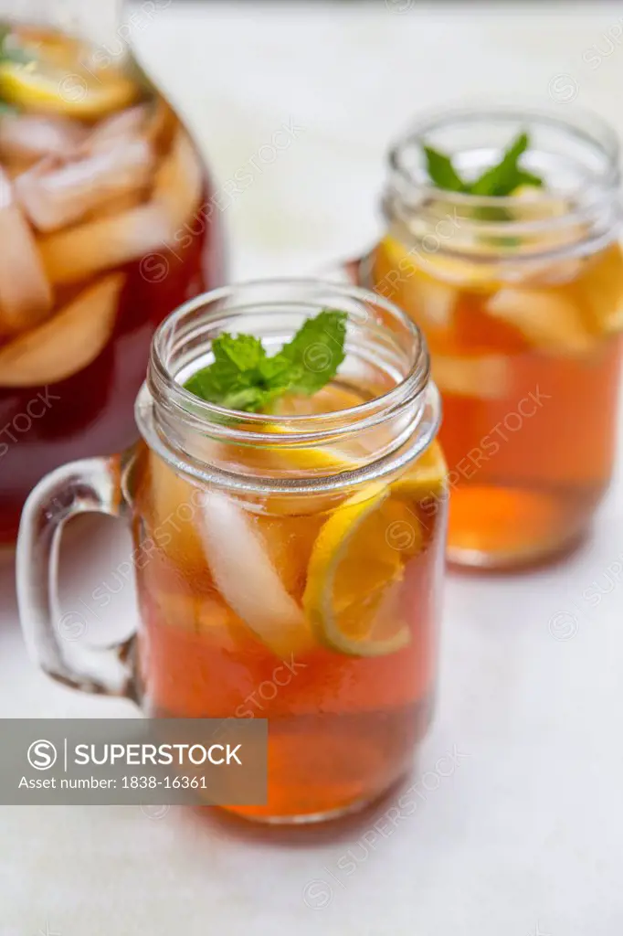 Iced Tea in Glass Mugs with Lemon and Mint
