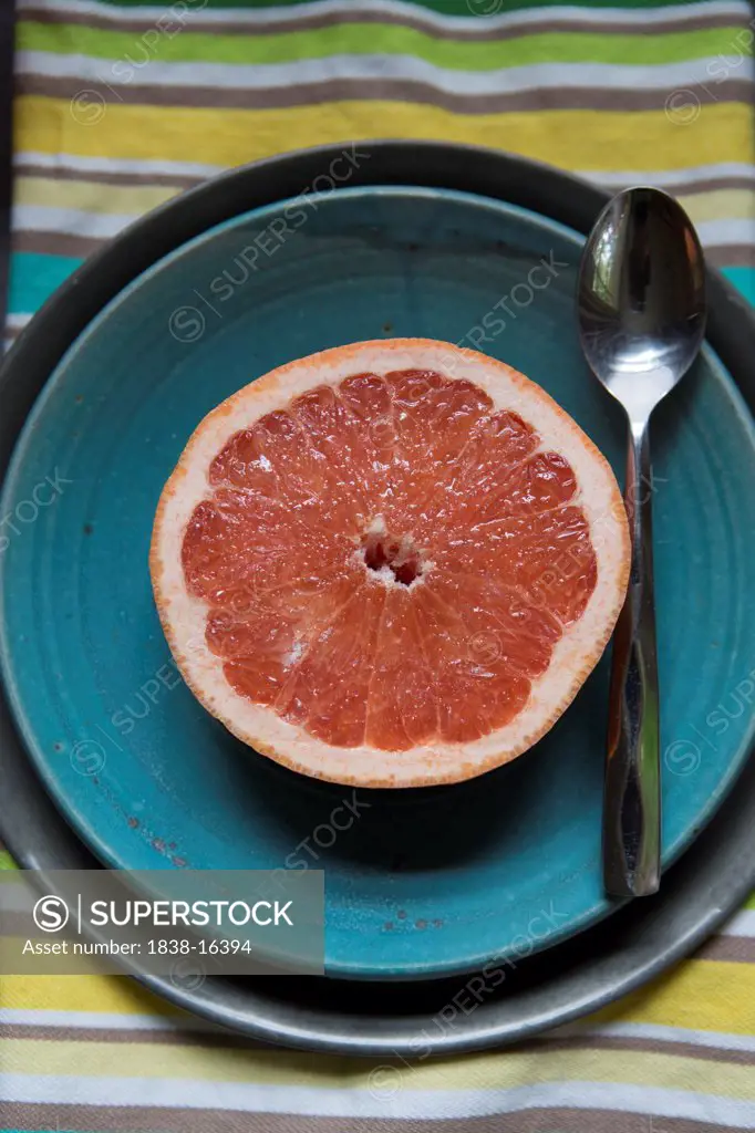 Sliced Grapefruit on Blue Plate