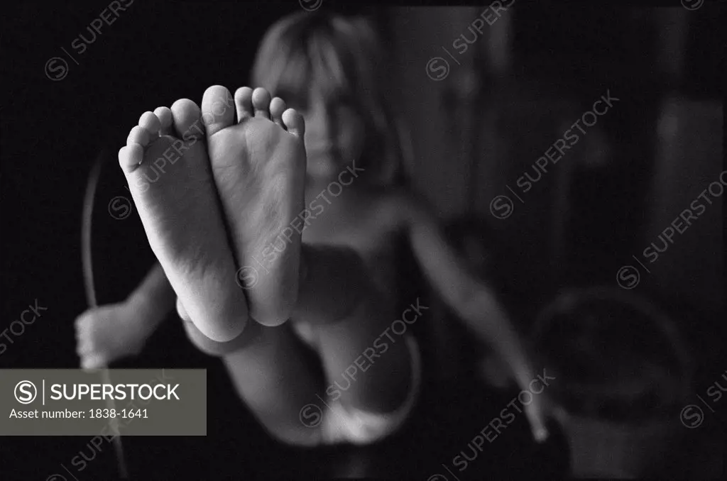 Little Girl Showing Her Feet