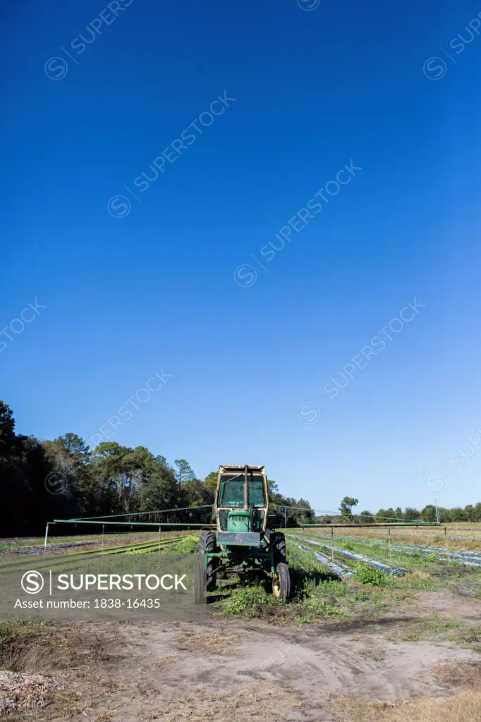 Tractor in Field on Farm