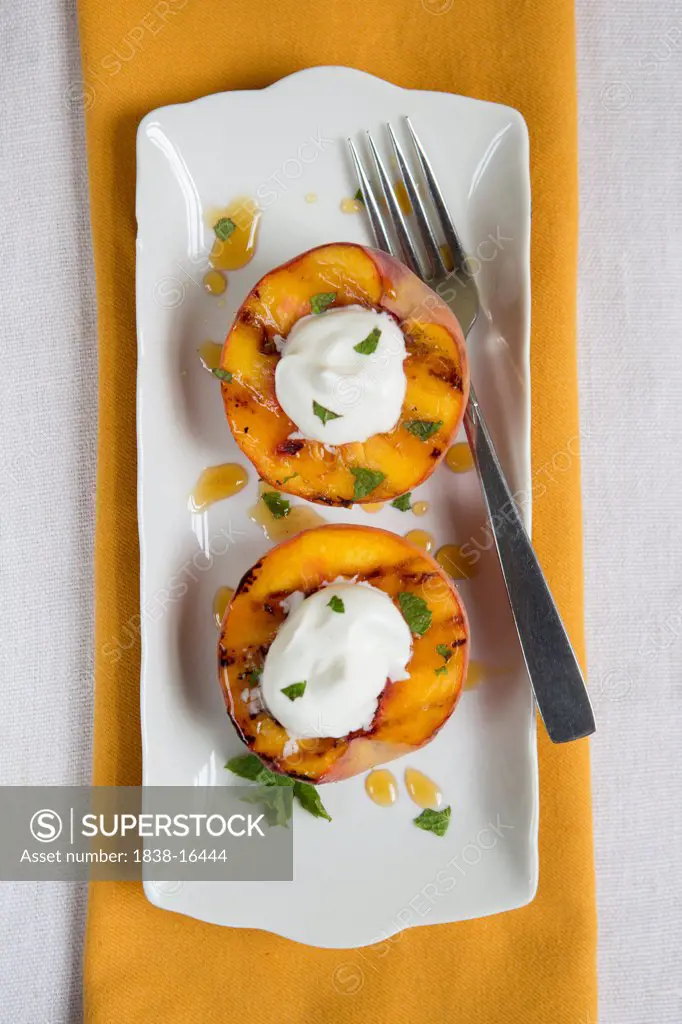 Grilled Peaches Topped with Whipped Cream