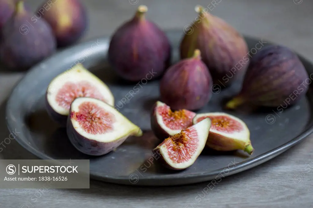 Sliced and Whole Figs on Plate
