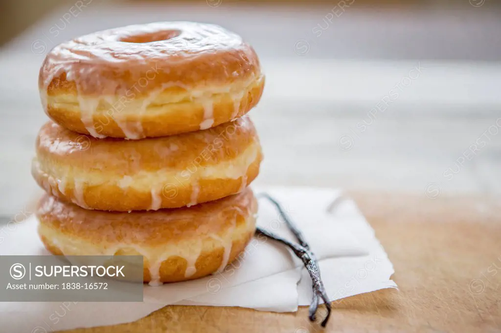 Stack of Glazed Donuts and Vanilla Beans