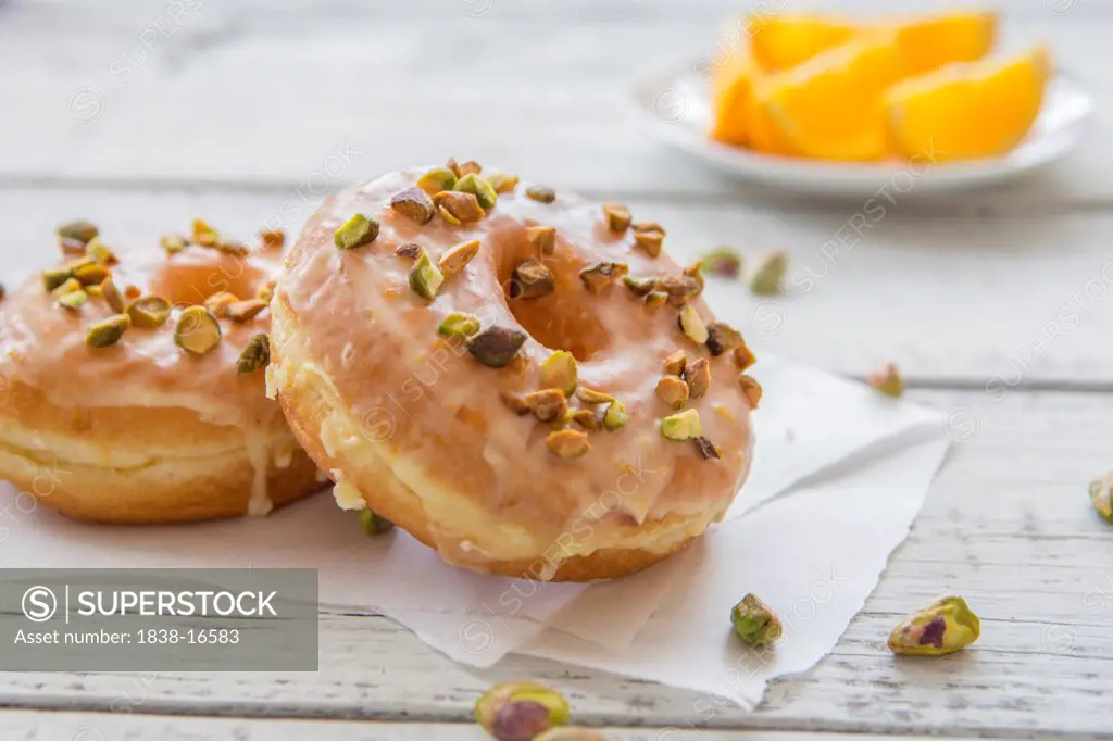 Donuts with Orange Glaze and Pistachios