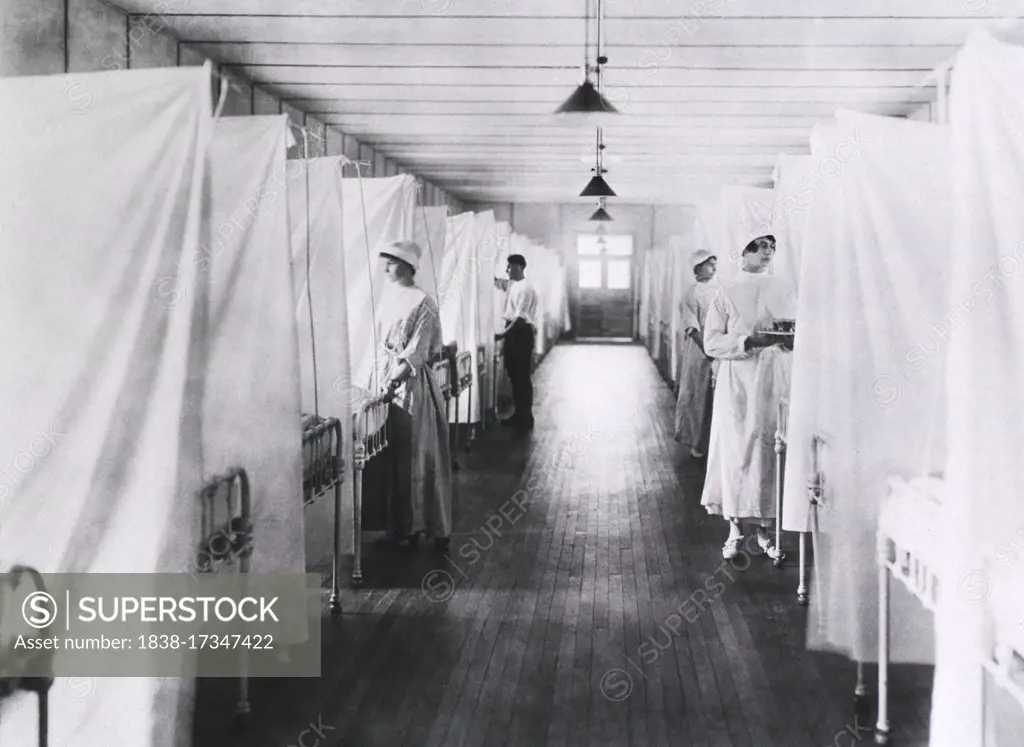 Nurses and Orderlies standing at foot of Beds separated by Sheets, Influenza Ward, U.S. Army, Walter Reed General Hospital, Washington, D.C., USA, 1918