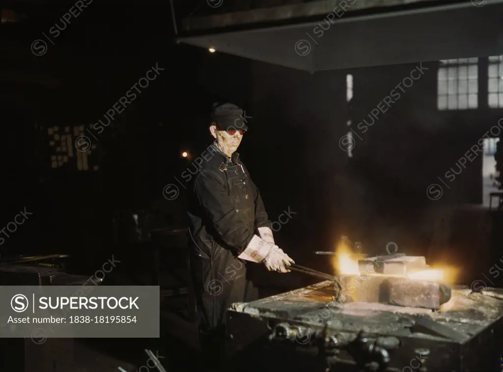 John Kelsch, Blacksmith, at forge in Blacksmith Shop at Roundhouse, Rock Island, Railroad, Blue Island, Illinois, USA, Jack Delano, U.S. Office of War Information, April 1943