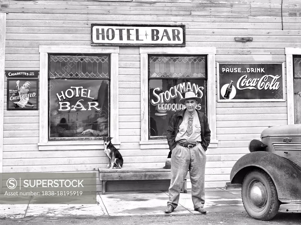 Man standing in front of Hotel Bar, Big Piney, Wyoming, USA, Marion Post Wolcott, U.S. Farm Security Administration, September 1941