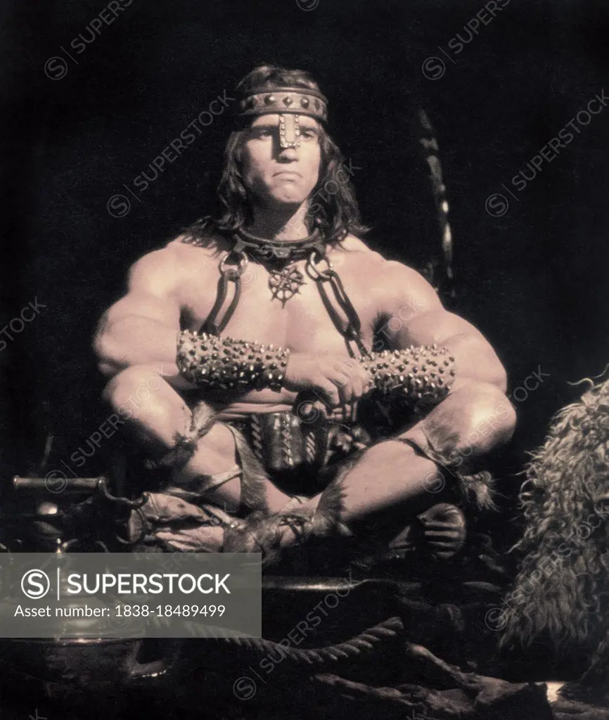 Arnold Schwarzenegger, Full-Length Seated Portrait, on-set of the Film, "Conan the Destroyer", Universal Pictures, 1984